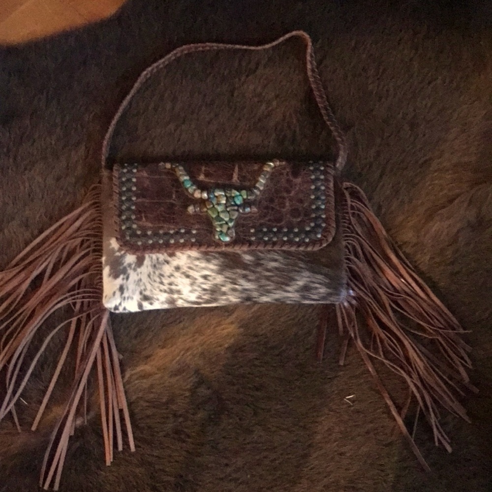 Cowhide and Turquoise shoulder bag . This unique bag is in exceptional